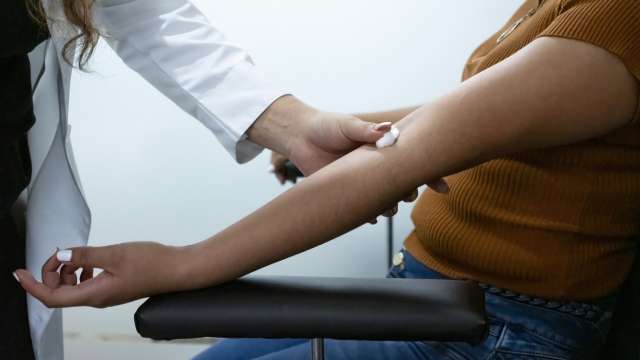 Person getting blood withdrawn